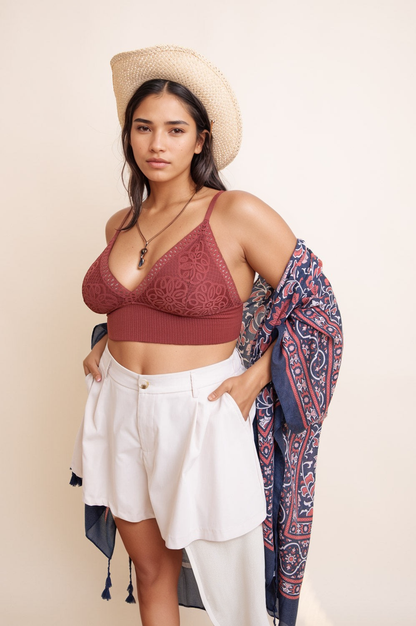 Plus size lace brami in burgundy with adjustable straps and soft support, styled with a hat and shawl