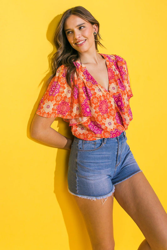 Printed Woven Bodysuit With Surplice Neckline And Snap Closure