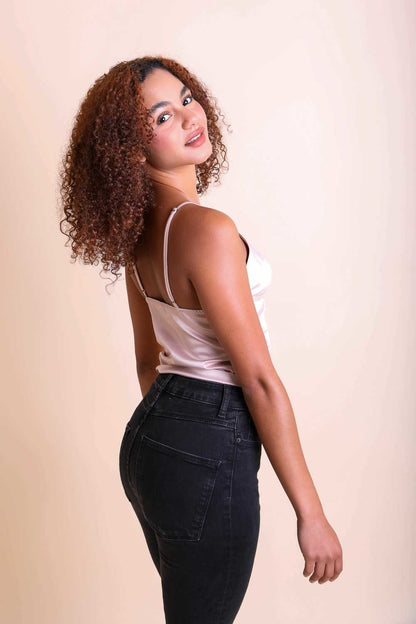 Leto Collection boho satin crop top in soft pink paired with black high-waisted jeans for a stylish look