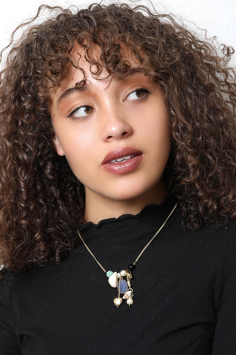 Leto Collection model wearing Boho Necklace, Boho Chic Jewelry, Spiritual charm pendant with stones on gold chain