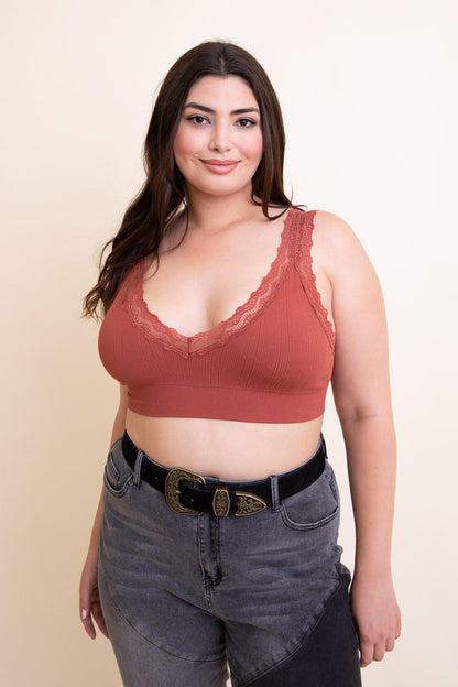 Boho suede western belt worn with high-waisted jeans and a lace-trimmed bralette