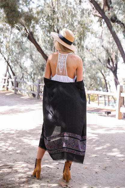 Boho tattoo back slip dress by Leto Collection worn with a shawl and hat in a natural outdoor setting