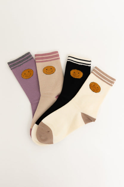 Set of Leto Collection boho crew socks for women in lavender, beige, and black with smiley face embroidery