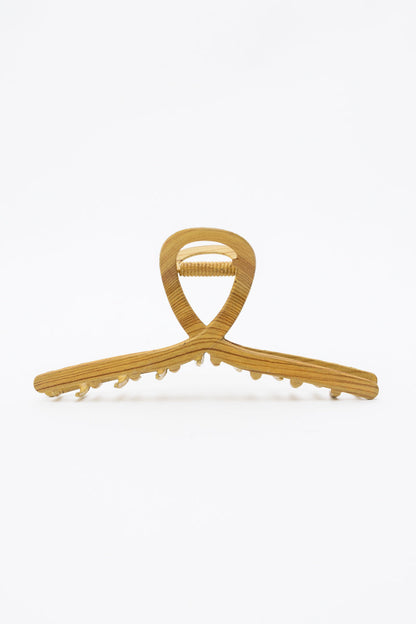 Twisted fun wood grain metal hair claw clip, durable and stylish.