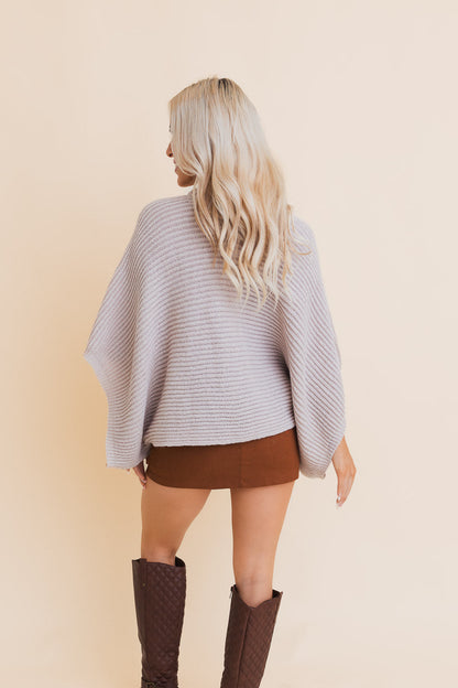 Light gray ribbed knit poncho for women with a relaxed fit, perfect for layering in cool weather