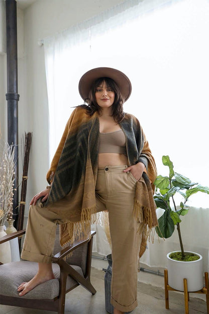 Leto Collection western serape tassel shawl styled with a trendy outfit in a bright indoor setting